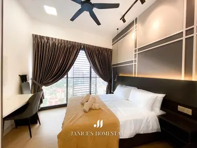 a bedroom with a bed with a ceiling fan and a desk at Continew Residence by Janice's Homestay in Kuala Lumpur