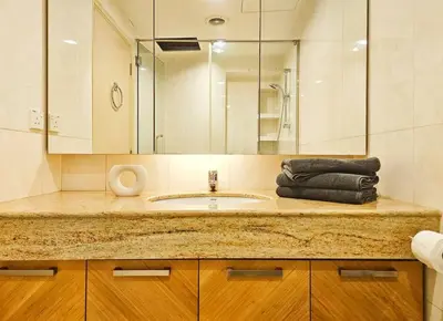 a bathroom with a sink and a mirror at Fahrenheit Bukit Bintang Big Group 13Pax Family Suites in Kuala Lumpur