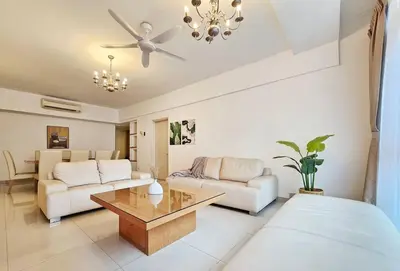 a living room with a couch and a table at Fahrenheit Bukit Bintang Big Group 13Pax Family Suites in Kuala Lumpur