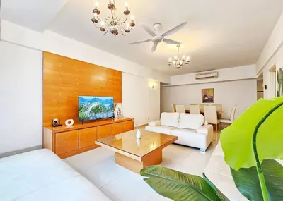 a living room with a couch and a table at Fahrenheit Bukit Bintang Big Group 13Pax Family Suites in Kuala Lumpur