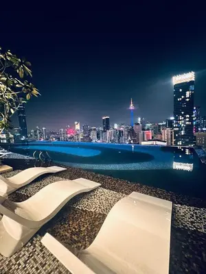 a view of a city at night from a building at AXON Residences Kuala Lumpur in Kuala Lumpur