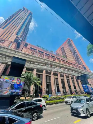 a large building with cars parked in front of it at Royal empire suite At Times square kl in Kuala Lumpur