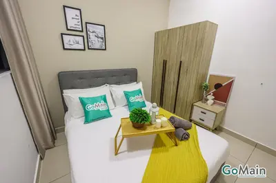 a bedroom with a bed and a table with plants on it at Suitable for Long Stay For 2-4 Trion Bukit Bintang Near KL KLCC in Kuala Lumpur