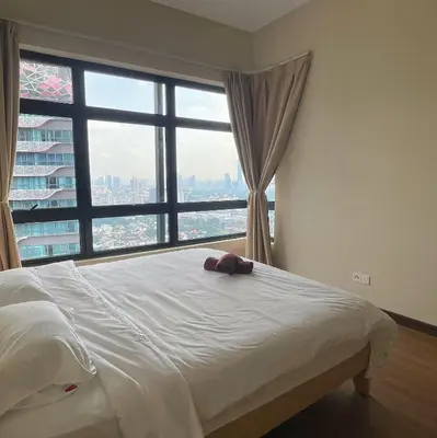 a bed in a room with a large window at Astoria Ampang x Near KLCC TRX BigRoom 12pax in Kuala Lumpur