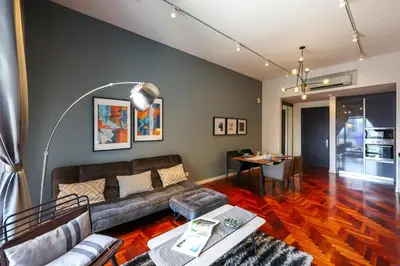 a living room with a couch and a table at The Mews KLCC by GB in Kuala Lumpur