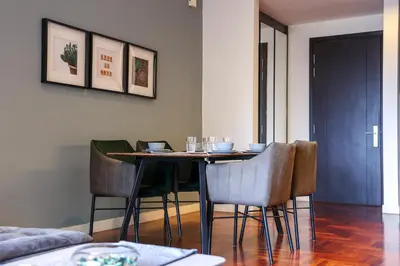 a dining room with a table and chairs at The Mews KLCC by GB in Kuala Lumpur
