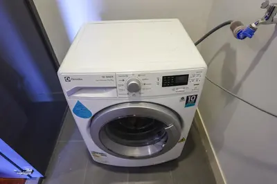 a washing machine with a white top in a room at The Mews KLCC by GB in Kuala Lumpur