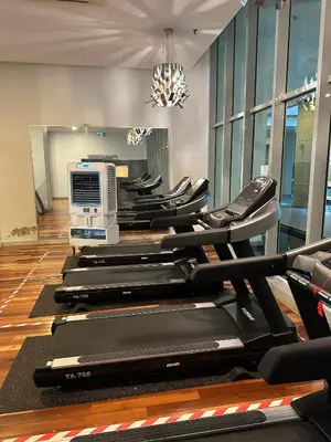 a row of treadmills in a gym at Regalia Infinity Skypool in Kuala Lumpur