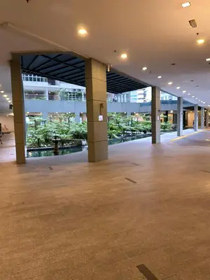 an empty lobby of a large building with columns at Regalia Infinity Skypool in Kuala Lumpur