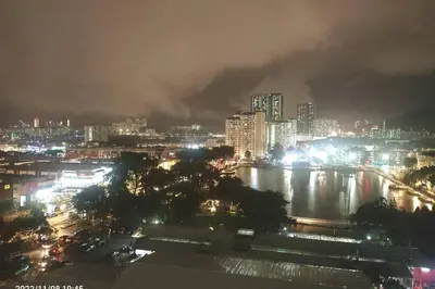 a city at night with a river and buildings at Residensi Rampai 2 - lake view in setapak in Kuala Lumpur