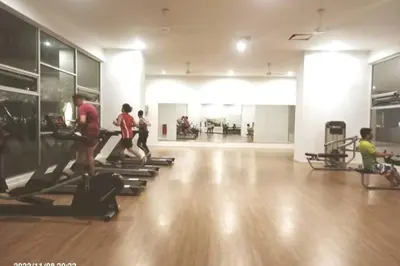 a group of people running on treadles in a gym at Residensi Rampai 2 - lake view in setapak in Kuala Lumpur