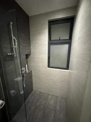 a bathroom with a shower and a window at TRION 2, KLCC TRX IKEA at Chan Sow Lin, Kuala Lumpur by One Guesthouse in Kuala Lumpur