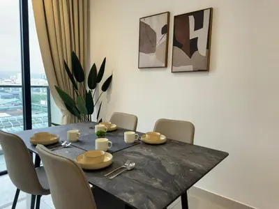 a dining room with a table and chairs at TRION 2, KLCC TRX IKEA at Chan Sow Lin, Kuala Lumpur by One Guesthouse in Kuala Lumpur