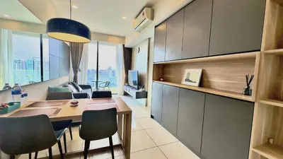 a room with a table and chairs in a room at Balcony Cityscape III The Robertson Residence 41f in Kuala Lumpur