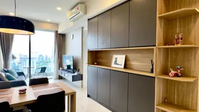 a living room with a desk and a dining room at Balcony Cityscape III The Robertson Residence 41f in Kuala Lumpur