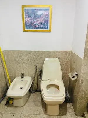 a bathroom with a toilet and a sink at Gorgeous service suite at Imbi in Kuala Lumpur