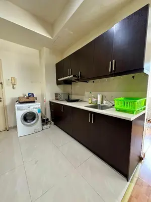 a kitchen with a sink and a washing machine at Parkview KLCC ITSKAYA 21 NEW in Kuala Lumpur