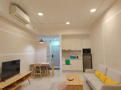 a living room with a couch and a table at Chambers Residence KLCC in Kuala Lumpur