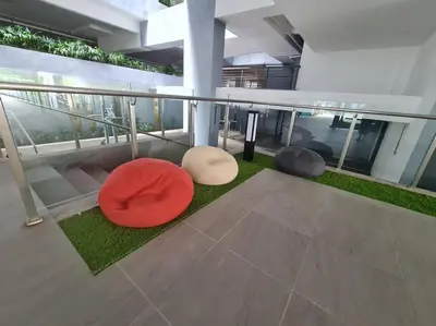 a balcony with three circular objects on the floor of a building at Mini Studio Near Gleneagles 10 mins to KLCC in Kuala Lumpur