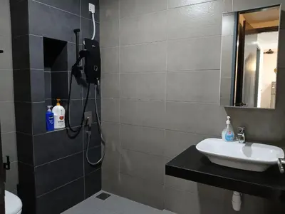 a bathroom with a sink and a shower at 2BR Centre MontKiara 4px 500Mbps in Kuala Lumpur