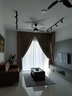 a living room with a couch and a ceiling fan at 2BR Centre MontKiara 4px 500Mbps in Kuala Lumpur