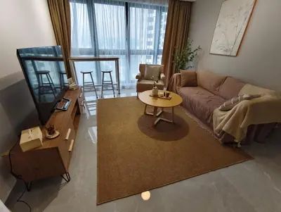 a living room with a couch and a table at Agile Bukit Bintang KLCC in Kuala Lumpur
