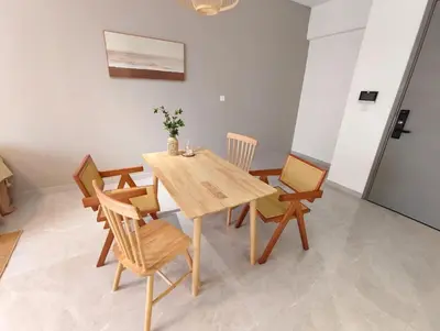 a dining room with a wooden table and chairs at Agile Bukit Bintang KLCC in Kuala Lumpur