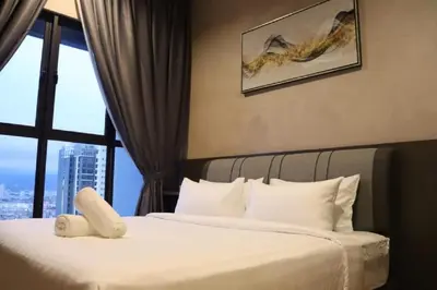 two beds in a hotel room with a window at Trion SFM Dream Service suit in Kuala Lumpur