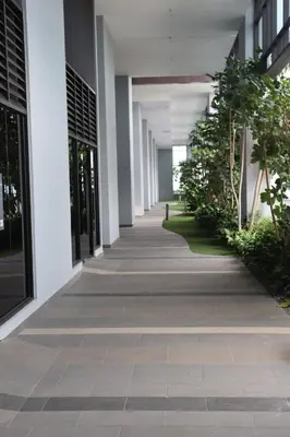an empty hallway of an office building with plants at Trion SFM Dream Service suit in Kuala Lumpur