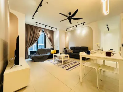 a living room with a ceiling fan and a table at Arcoris Residence Mont Kiara by DeUrban in Kuala Lumpur