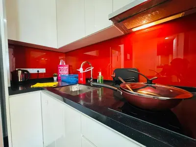 a kitchen with a copper bowl on the stove at Arcoris Residence Mont Kiara by DeUrban in Kuala Lumpur