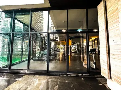 an empty lobby of a building with glass doors at Nordic Europe Style in Kuala Lumpur