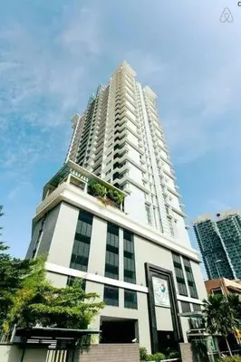 a tall white building with a clock on it at 0203 Sweet Home-Casa Residency 2R 2B City View in Kuala Lumpur