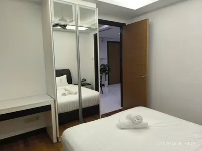 a hotel room with two beds and a mirror at 0203 Sweet Home-Casa Residency 2R 2B City View in Kuala Lumpur