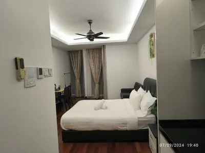 a bedroom with a bed and a ceiling fan at 0203s Sweet Home-Casa Residency in Kuala Lumpur