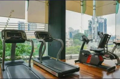 a gym with two exercise bikes in front of a window at 0203s Sweet Home-Casa Residency in Kuala Lumpur