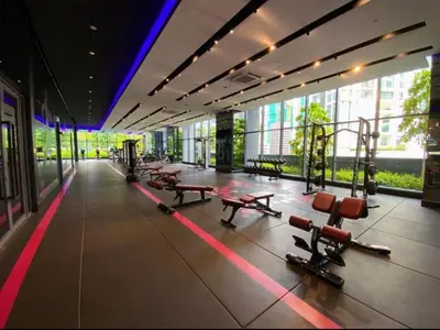 a gym with benches and machines in a building at Star Luxury By Star Residences KLCC in Kuala Lumpur