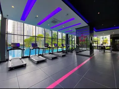 a gym with a row of chairs in a building at Star Luxury By Star Residences KLCC in Kuala Lumpur