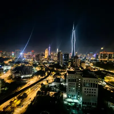 a city skyline at night with a tall building at KL Sentral Dua Sentral King Bedroom Suite With Merdeka 118 and KLCC View #FreeParking in Kuala Lumpur