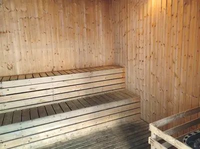 a wooden sauna with a wooden bench in it at 8 KLCC 5 minutes to Jalan Alor Street Bukit Bintang Pavilion 10 Pax 3R2B in Kuala Lumpur