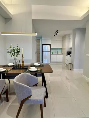 a kitchen and dining room with a table and chairs at KL Central 31st floor KLCC view in Kuala Lumpur