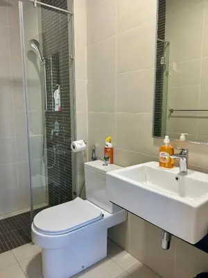 a bathroom with a toilet and a sink and a shower at KL Central 33rd Floor KLCC view in Kuala Lumpur