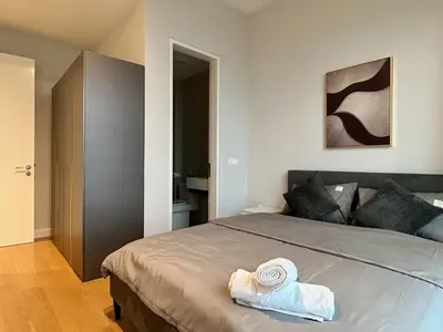a bedroom with a bed with towels on it at KL Central 33rd Floor KLCC view in Kuala Lumpur