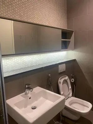 a bathroom with a sink and a toilet at Studio with Amazing KLCC View & Infinity Pool at Lalaport Bukit Bintang in Kuala Lumpur