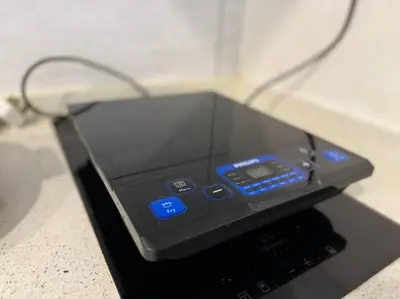an electronic device with blue lights on a table at The Robertson Bukit Bintang by DeUrban in Kuala Lumpur