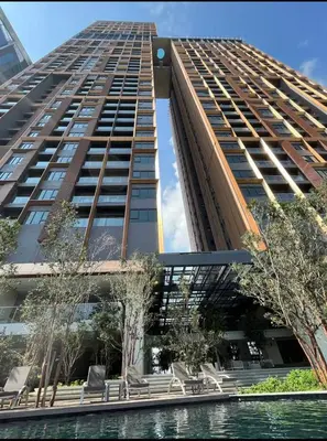 a tall building with a pool in front of it at Lucentia Residence Bukit Bintang by Ideal Homes in Kuala Lumpur