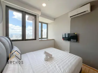 a bedroom with a white bed and a tv at Riveria City Kuala Lumpur Sentral by Archos in Kuala Lumpur