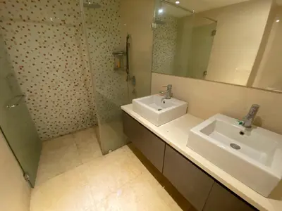 a bathroom with a sink and a mirror at KL Infinity Pool Hostel in Kuala Lumpur