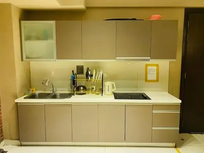 a kitchen with a sink and a counter top at KL Infinity Pool Hostel in Kuala Lumpur