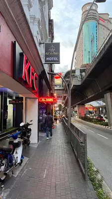 a street with a kfc sign on the side of a building at Hotel AL Amin By Ahmed in Kuala Lumpur